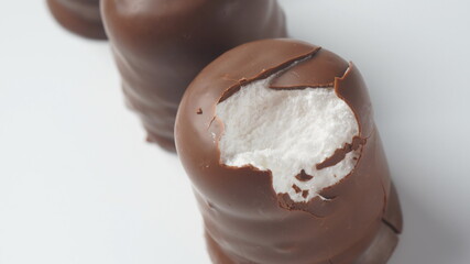 White Chocolate Krembo on the table. A chocolate-coated marshmallow treat that is popular in Israel.