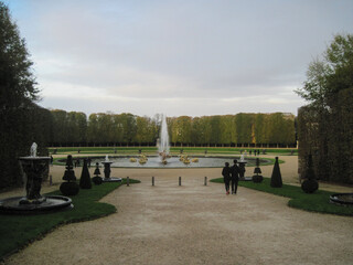 Walk in the morning park. Panoramic landscape with fountains in the park. Scenic view with walk...