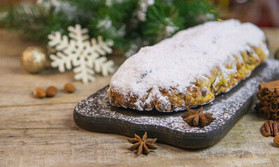 Stollen Christmas cake on the table. Selective focus.