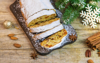 Stollen Christmas cake on the table. Selective focus.