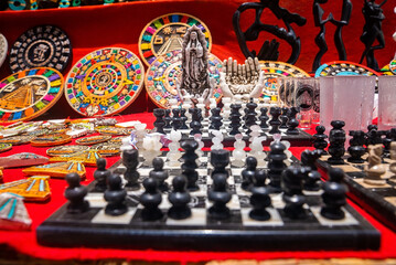 Cancun, Mexico. May 30, 2021. Historic mexican art souvenirs and chessboard with chess pieces for...