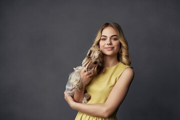 Fototapeta premium pretty woman a small dog pet fun cropped view fashion