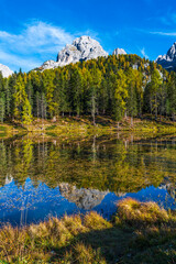 Autumn colors on the lake of Antorno. Magical glimpses of the Dolomites. Three peaks of Lavaredo