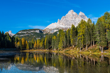 Autumn colors on the lake of Antorno. Magical glimpses of the Dolomites. Three peaks of Lavaredo