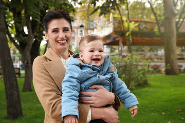 Portrait of happy mother with her son in park