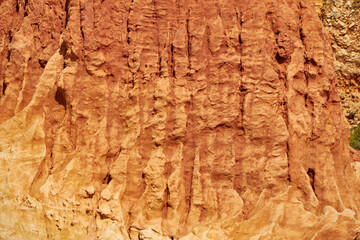 Texture of a reddish stone wall