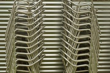 Chairs stacked forming rhythm