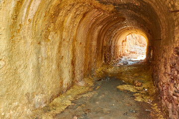 Reddish-hued mine or cavern entrance