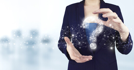 FAQ frequently asked questions concept. Two hand holding virtual holographic question mark icon...