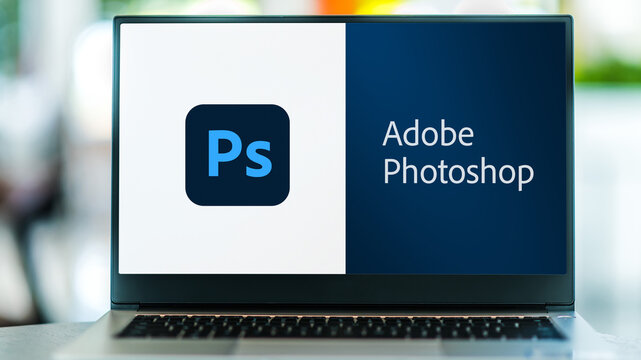 Laptop computer displaying logo of Adobe Photoshop