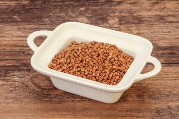 Raw buсkwheat cereal in the bowl