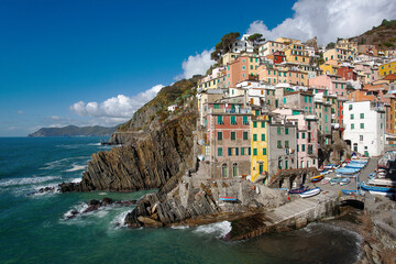 Stunning view of the colourful costal village of Riomaggiore part of "cinque terre" five lands , one of the most famous Italian tourist attractions. Liguria Italy, Europe.