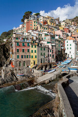 Stunning view of the colourful costal village of Riomaggiore part of "cinque terre" five lands , one of the most famous Italian tourist attractions. Liguria Italy, Europe.