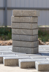 Fototapeta premium Laying paving slabs at a construction site.