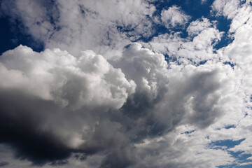 Cumulus clouds in the blue sky. No land view.