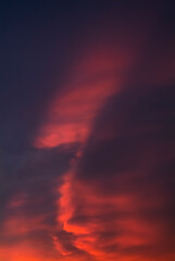 Colorful sunset sky with dramatic orange clouds. Only sky, no land.