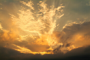 Naklejka na ściany i meble Colorful sunset sky with dramatic orange clouds. Only sky, no land.