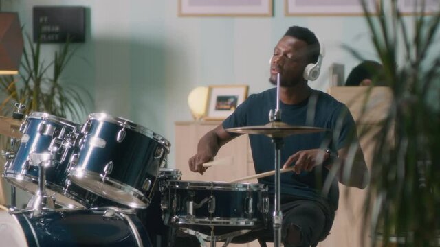 Black musician enjoying drum session