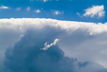 Cumulus clouds in the blue sky. No land view.