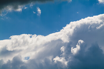 Cumulus clouds in the blue sky. No land view.