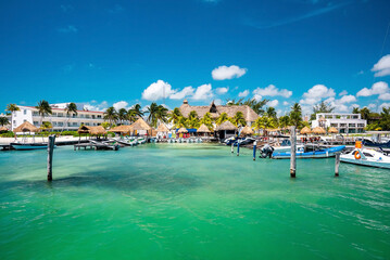 Cancun, Mexico. May 30, 2021. Luxury hotels and resorts with moored yachts or sailboat on sea water surface
