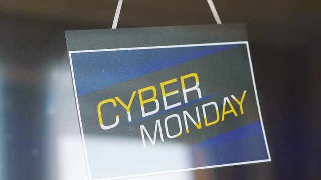 Cyber Monday Sale sign hanging on the door in 4K Slow motion 60fps