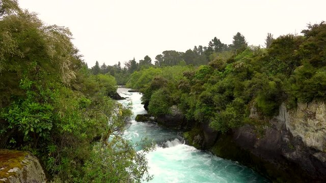 the majestic view of Huka Falls on the boat ride on a rainy day
