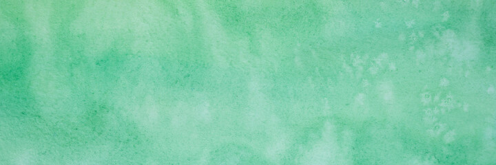green watercolor with white spots. painted textured paper with watercolor paints of different green color. background or backdrop of abstract art handmade diy painting