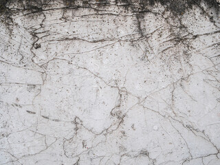 White cracked wall abstract background texture pattern.
