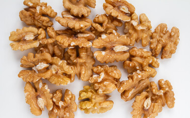 Fresh Walnuts. Peeled, hulled, without their hard brown shells. Nuts flat lay composition on a white background.
