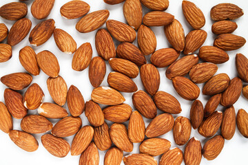 Fresh Almonds, hulled, unshelled. Flat lay composition on a white background.