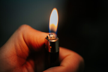 Lighter in the persons hand