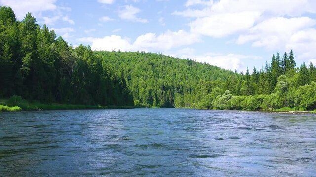 Middle Siberia, Krasnoyarsk Territory. Hilly (coniform hill) river bank. Taiga mixed forests