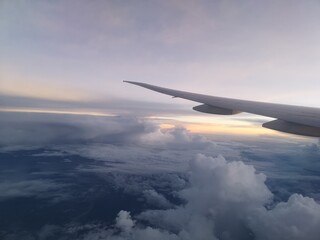 Cloud view and sunrise from airplane window