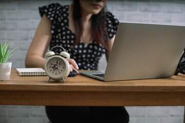 Hard working woman is always on time at work