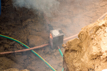 Welding copper ground wire on ground rod.Welding copper ground wire.Connect copper grounding lightning protection system. With the melting