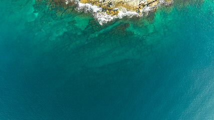 Fototapeta premium Underwater rocks in the crystal turquoise water, sea from above, aerial view.