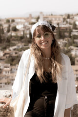 Vintage woman with sunglasses and a hat smiling and beauty
