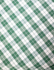 Background from checkered green and white fabric.