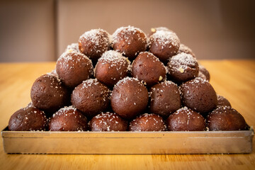 Exquisite Black Gulab Jamun: Tempting Image of India's Unique Sweet, Perfect for Food Lovers and Dessert Enthusiasts - High-Quality Picture