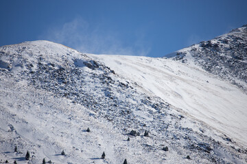 Snow covered the north slope of the Tian Shan Mountains, southeast Kazakhstan. Kolsay Lakes National Park.