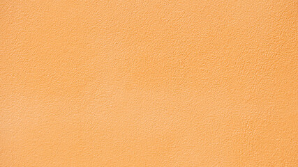 Fototapeta premium Background and textured of cement wall orange color for construction. There are traces of knuckles.