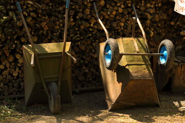 Wheelbarrow with blue wheels in the lumber yard © Andrzej - RajPlanet