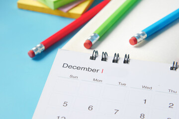 december month on calendar on office desk