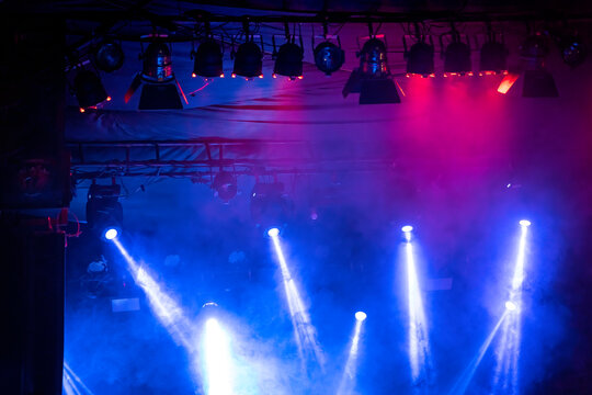 Flashing blue and pink lights on a rock concert, stage atmosphere fog