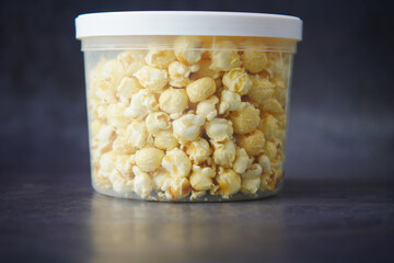  popcorn in a bowl on wooden desk