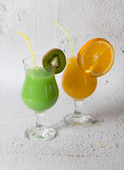 Backgrounf with fresh orange and kiwi juice 