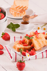 Lemon pound cake with honey and fresh strawberries.