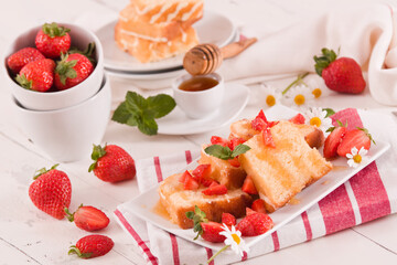 Lemon pound cake with honey and fresh strawberries.