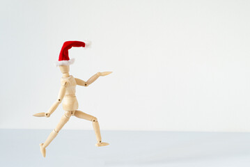 Christmas blank greeting card mock-up scene. Wooden mannequin posing on greeting card or gift list...